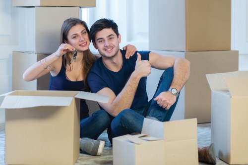 Office relocation team planning a local business move with packing materials and furniture