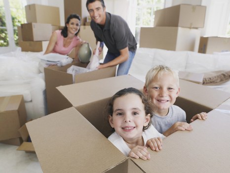 Professional office removals planning in Acton with moving boxes and desks