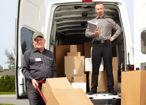 Packed boxes and furniture loaded into removal van