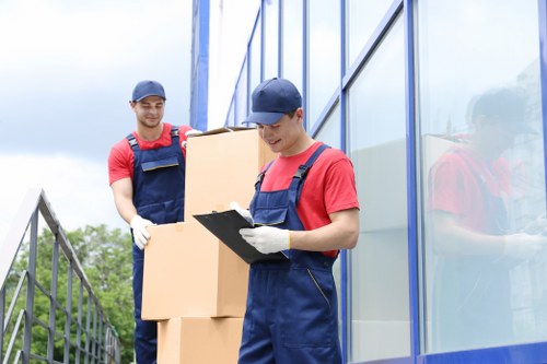 Acton Movers packing and recycling materials during a sustainable house move