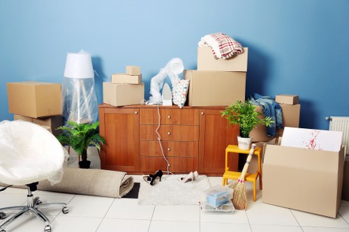 Trained movers handling furniture carefully inside a property
