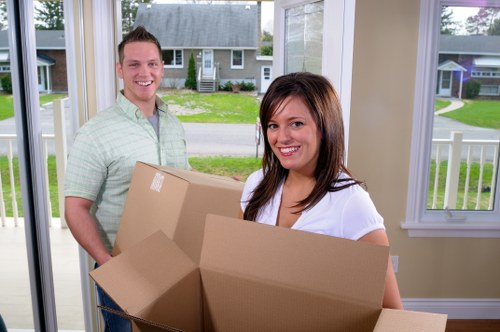 Packed furniture and boxes prepared for transport in Acton