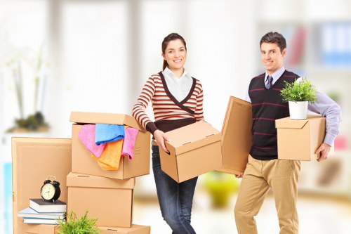Professional moving team loading furniture in Acton