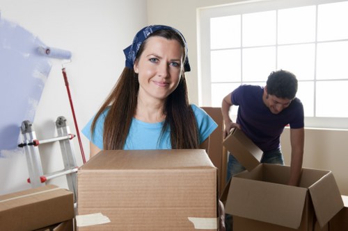 Carefully labelled moving boxes prepared for a house move in Acton