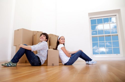 Moving boxes and household items prepared for house removals in Acton