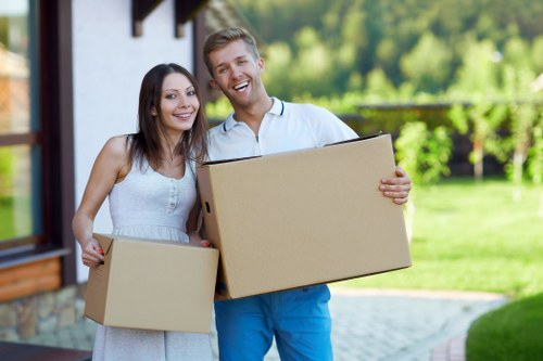 Local house removals team helping with boxes and furniture