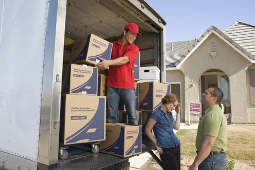 Reliable Acton movers organizing items for a smooth relocation