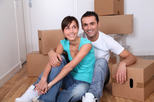 Careful packing materials and labeled moving boxes in Acton