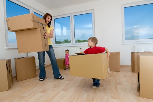 Movers handling boxes safely during a planned removal job