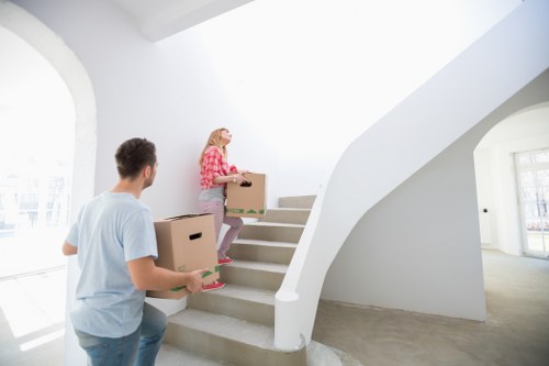 Professional house removalists packing and loading furniture in Acton