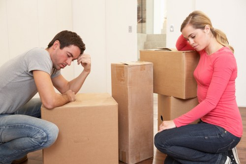 House movers in Acton organizing boxes and moving supplies during relocation