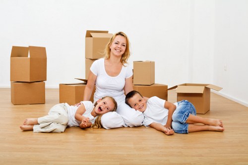 Unpacking boxes into a new home room by room after moving
