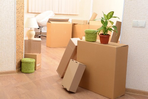 Commercial movers handling furniture and equipment with care during relocation