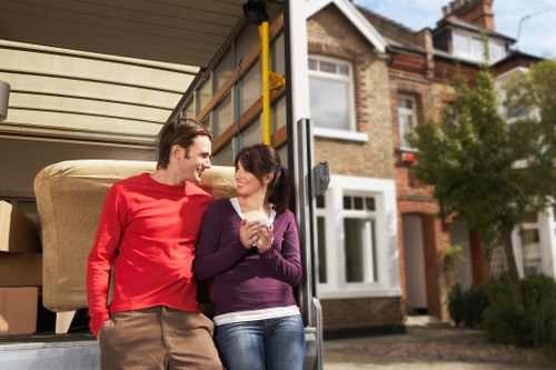 Local Acton house removalists loading a moving truck outside a residence