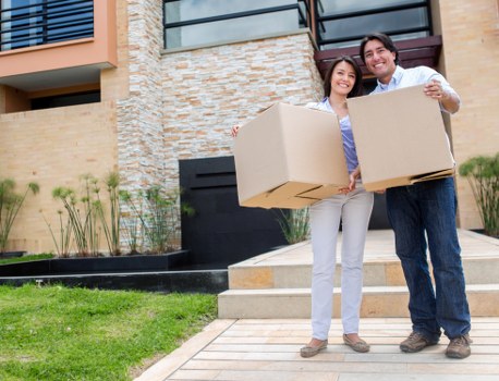 Packing boxes and furniture for storage in Acton
